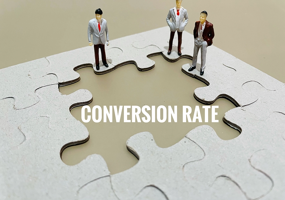 Miniature figures standing on a puzzle with a missing piece, labeled "Typical Conversion Rate".