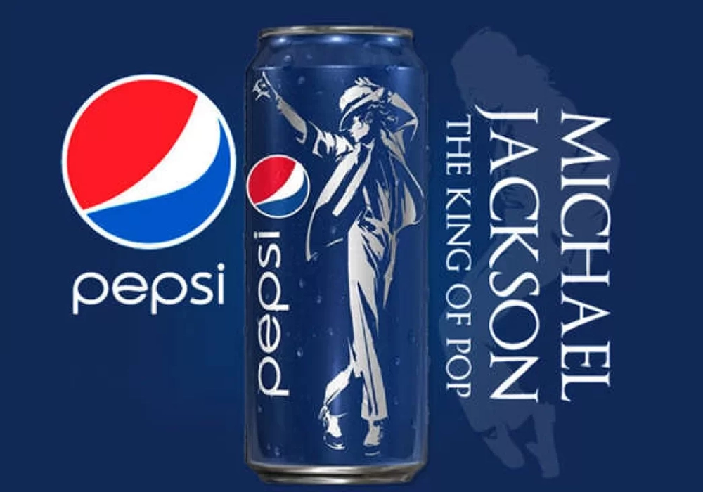 A promotional image featuring a Pepsi can with Michael Jackson's silhouette, labeled as "the king of pop," alongside the Pepsi logo on a blue background, showcasing one of Pepsi's celebrity endorsements.
