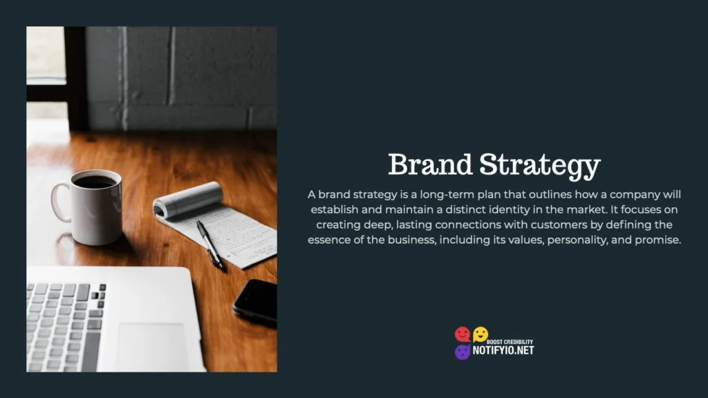 A desk with a laptop, smartphone, notepad, and coffee cup. Text on the right defines brand strategy as creating deep connections with customers based on the business's values and promise—highlighting the nuances of Brand Strategy vs Marketing Strategy.